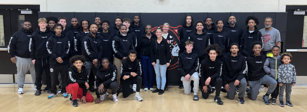 The Coatesville High School Boys' Basketball team wearing new warm-up hoodies